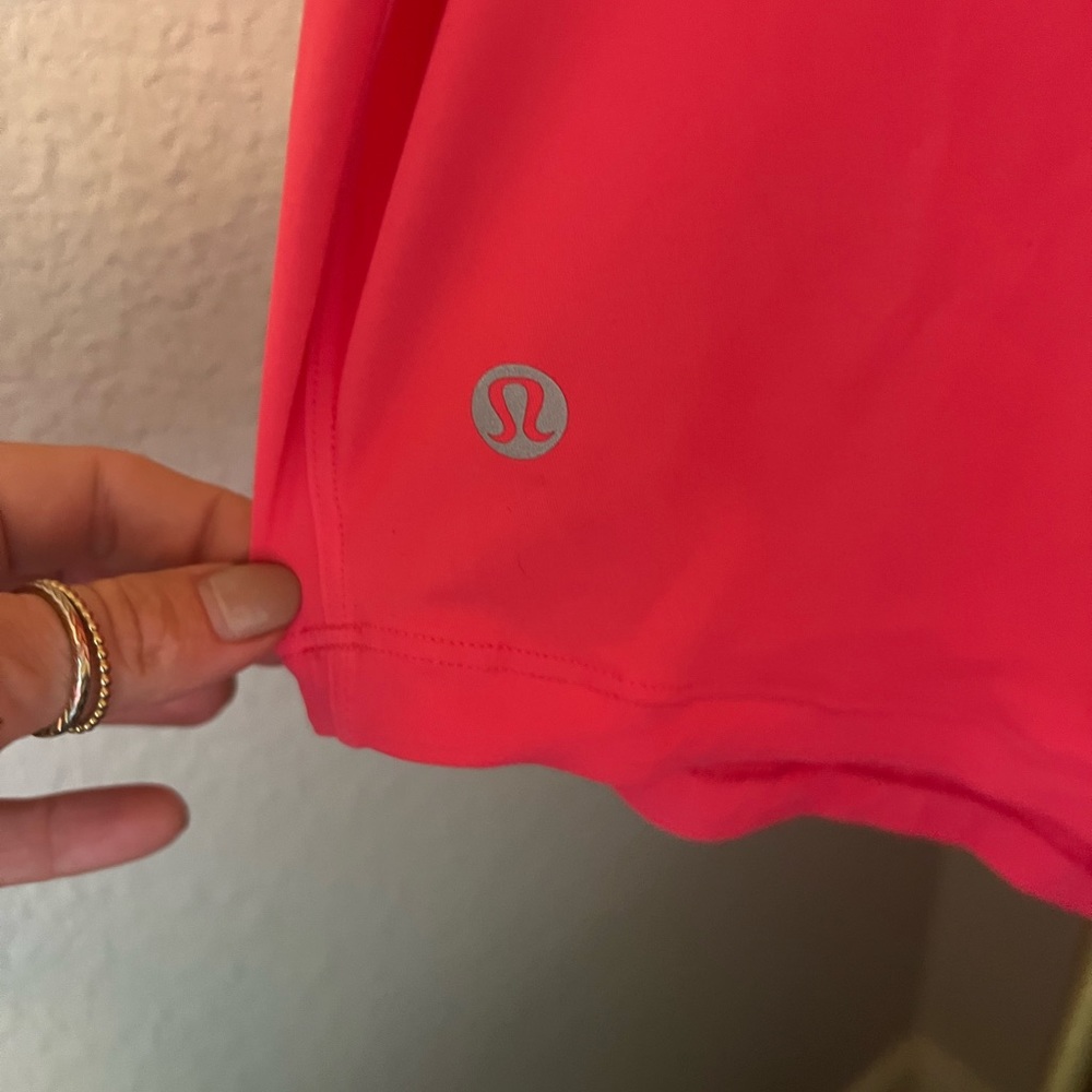 Lululemon workout top size 4.  Pink/salmon color - Picture 6 of 6